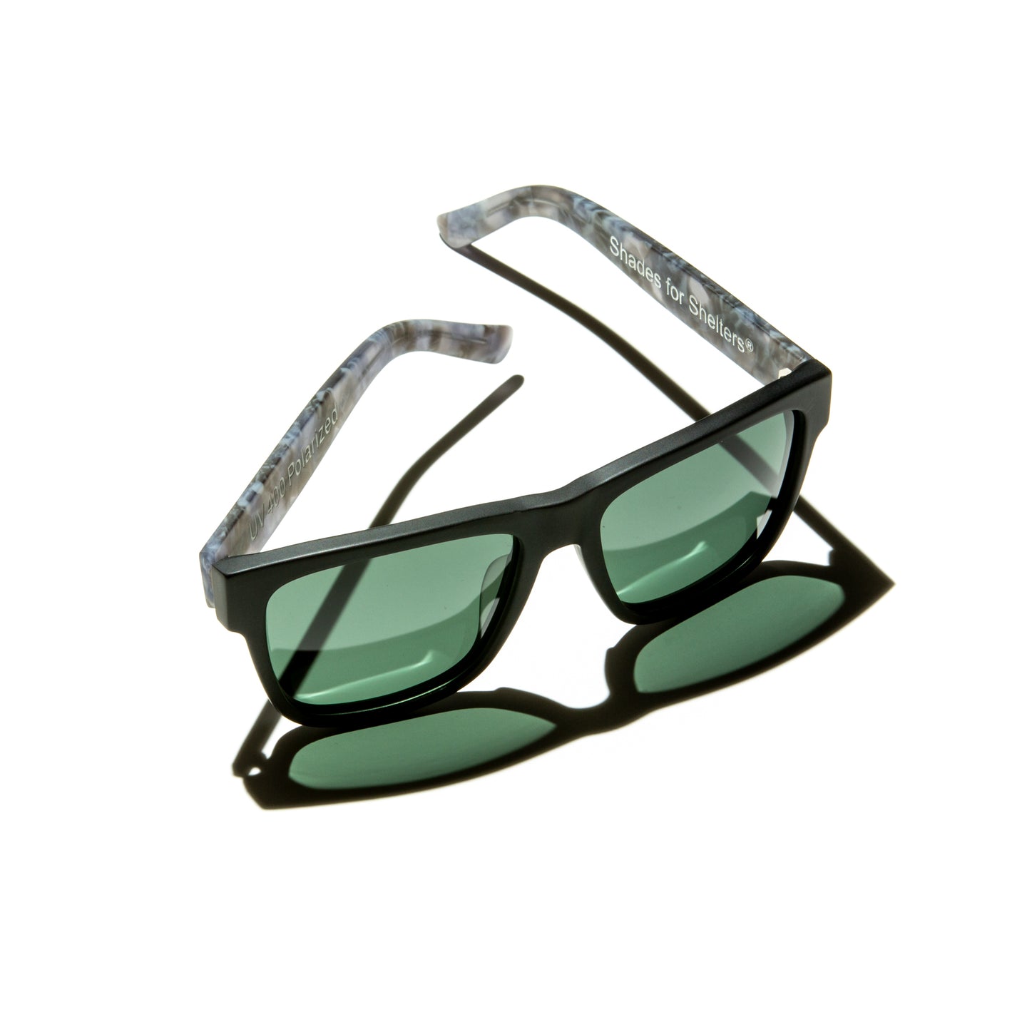Green lens sunglasses with matte cloudy gray temples