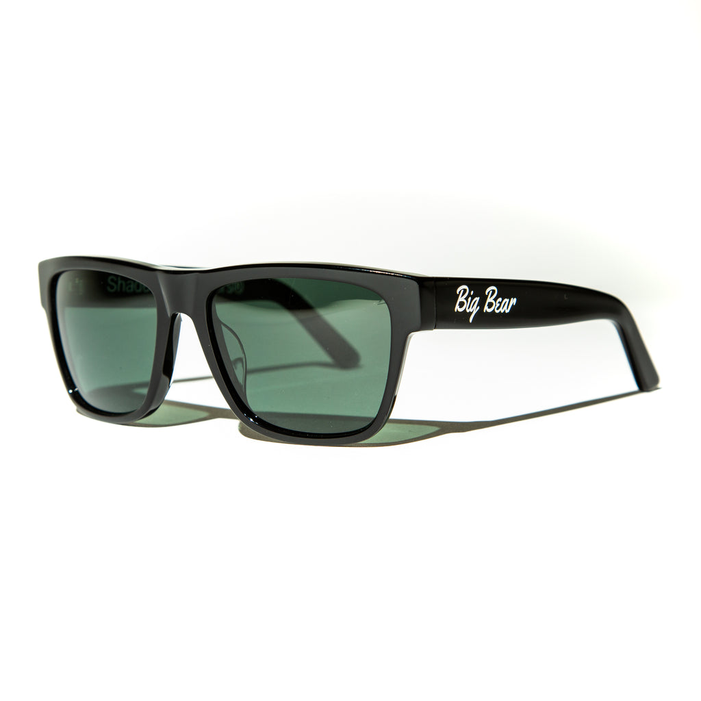 Green lens sunglasses with polished black temples