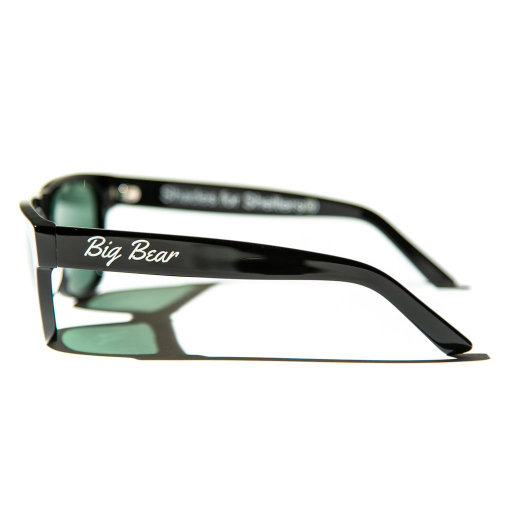 Green lens sunglasses with polished black temples