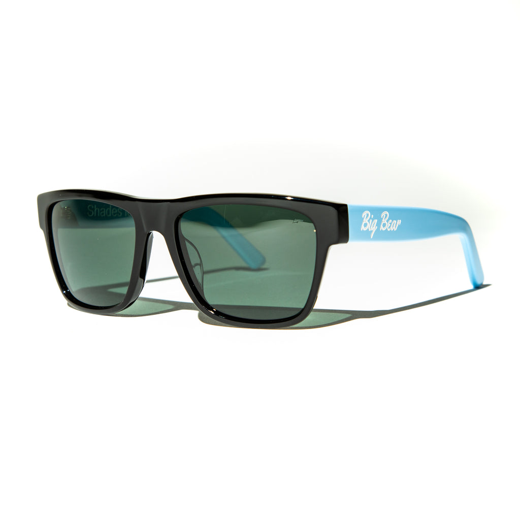 Green lens sunglasses with polished blue temples