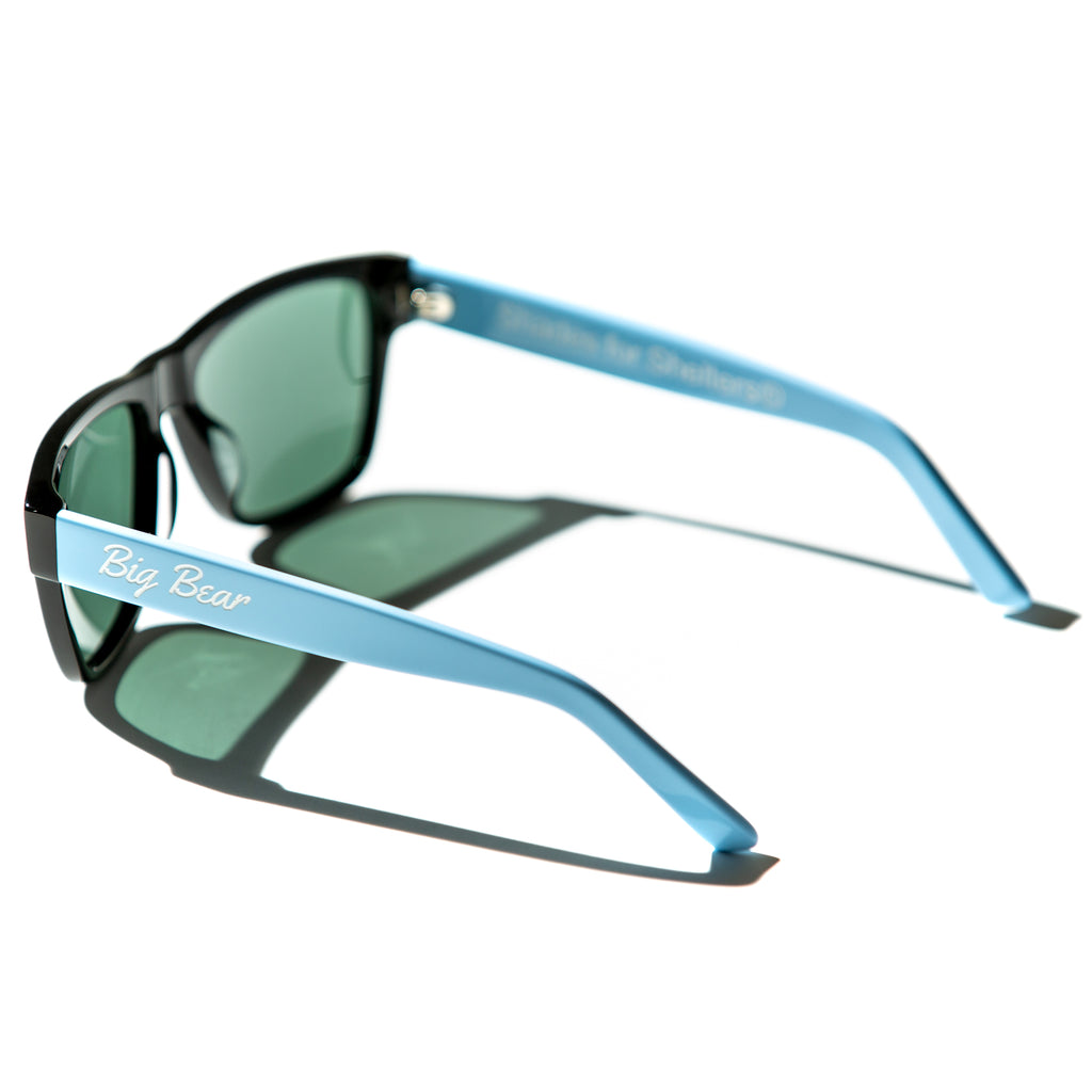 Green lens sunglasses with polished blue temples