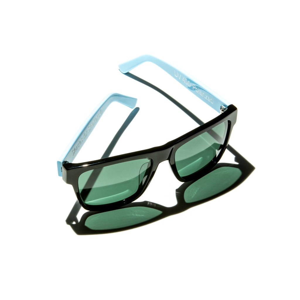 Green lens sunglasses with polished blue temples