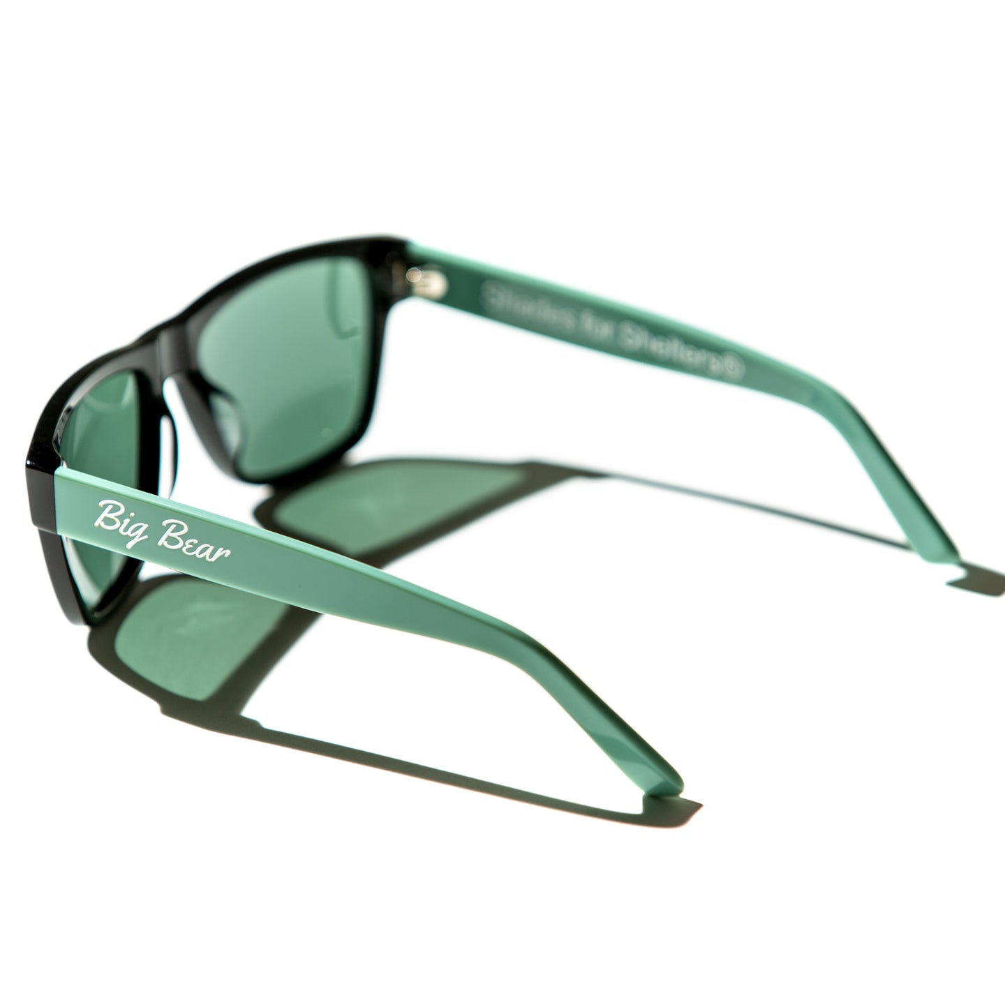 Green lens sunglasses with polished mint green temples