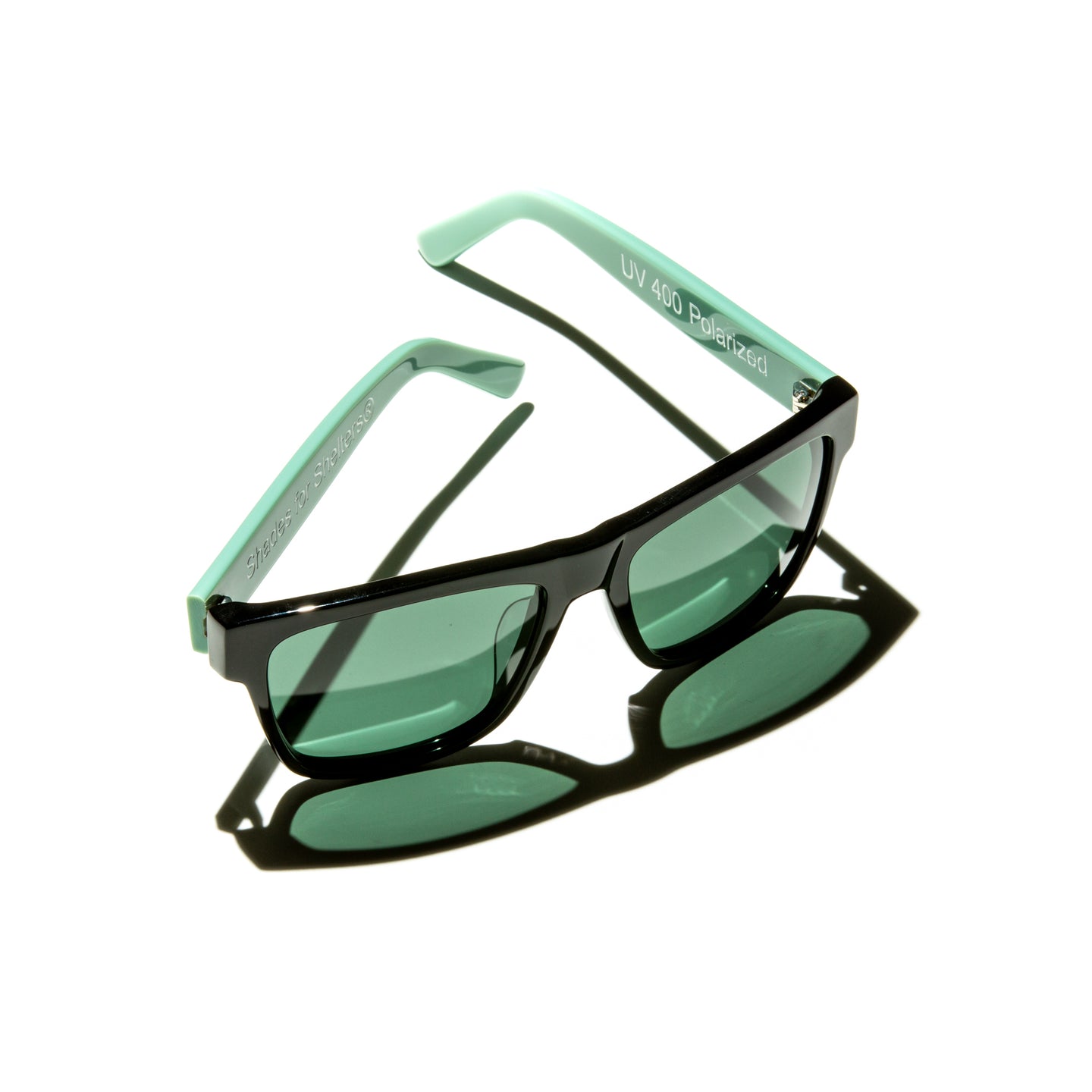 Green lens sunglasses with polished mint green temples