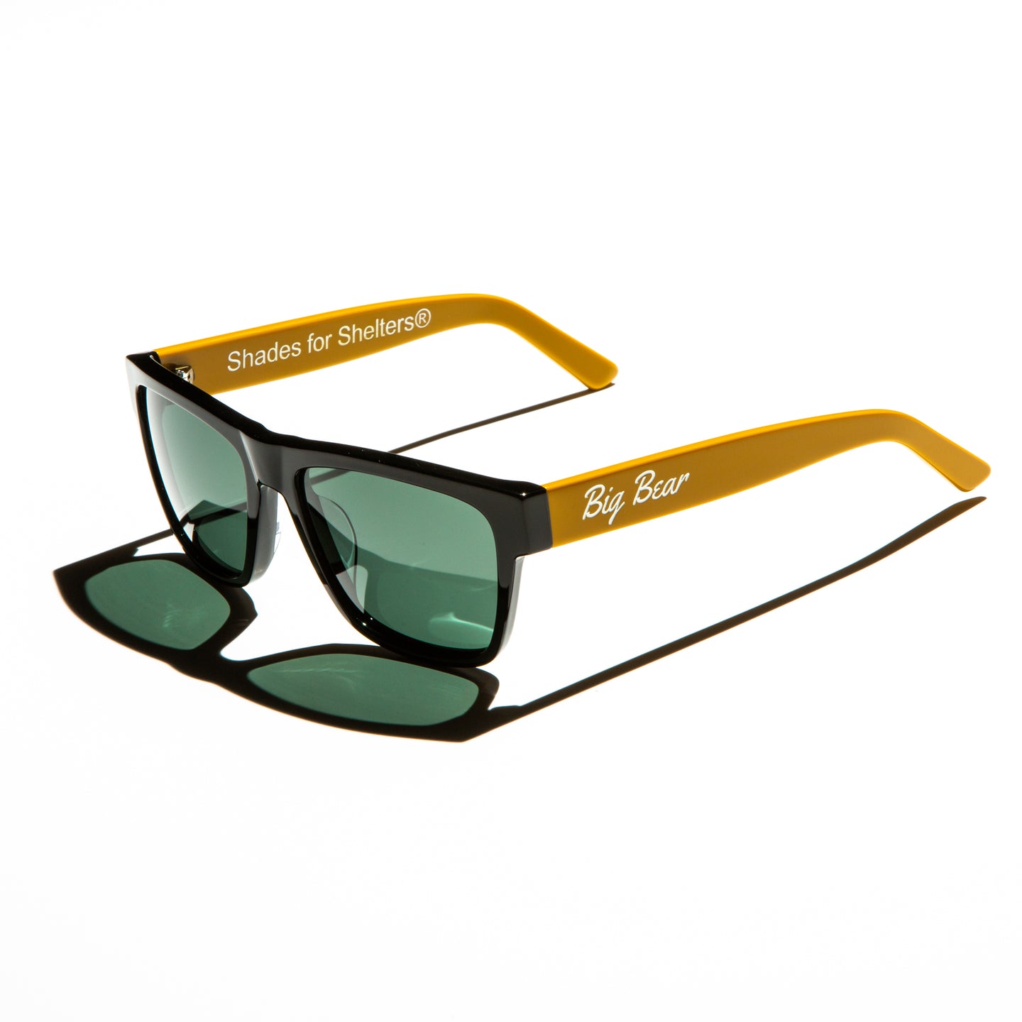 Green lens sunglasses with polished mustard yellow temples