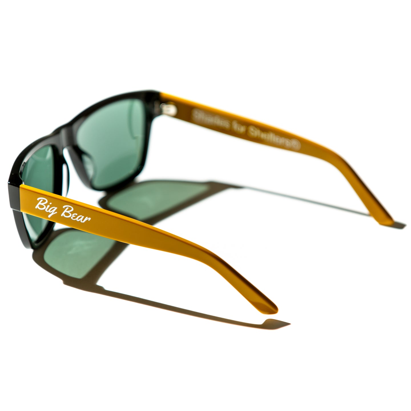 Green lens sunglasses with polished mustard yellow temples