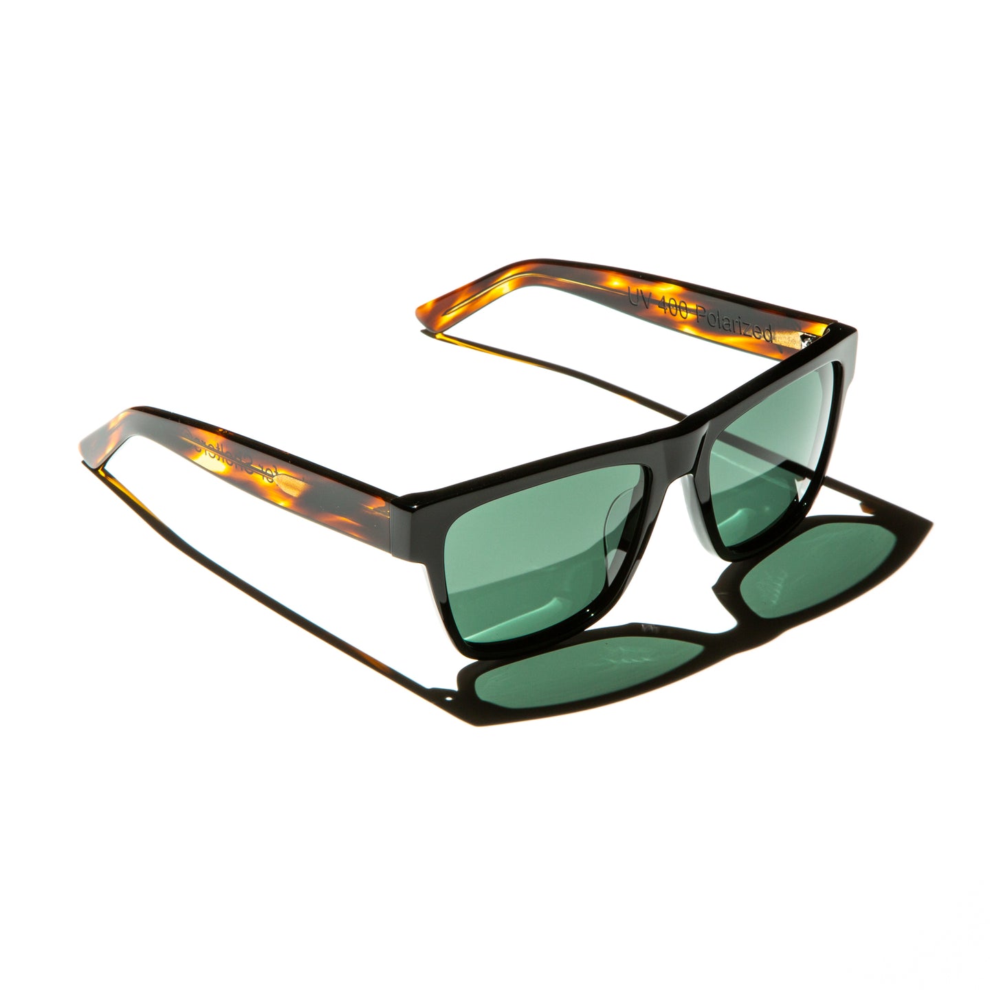 Green lens sunglasses with polished red havana temples
