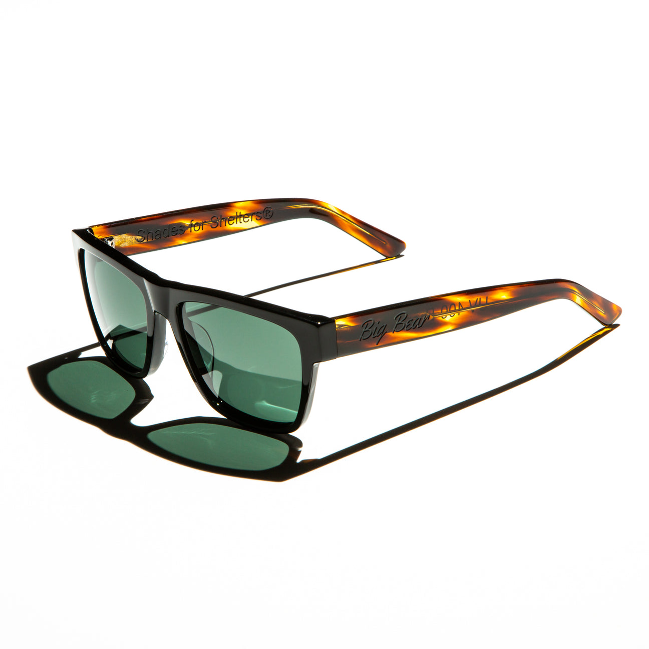 Green lens sunglasses with polished red havana temples