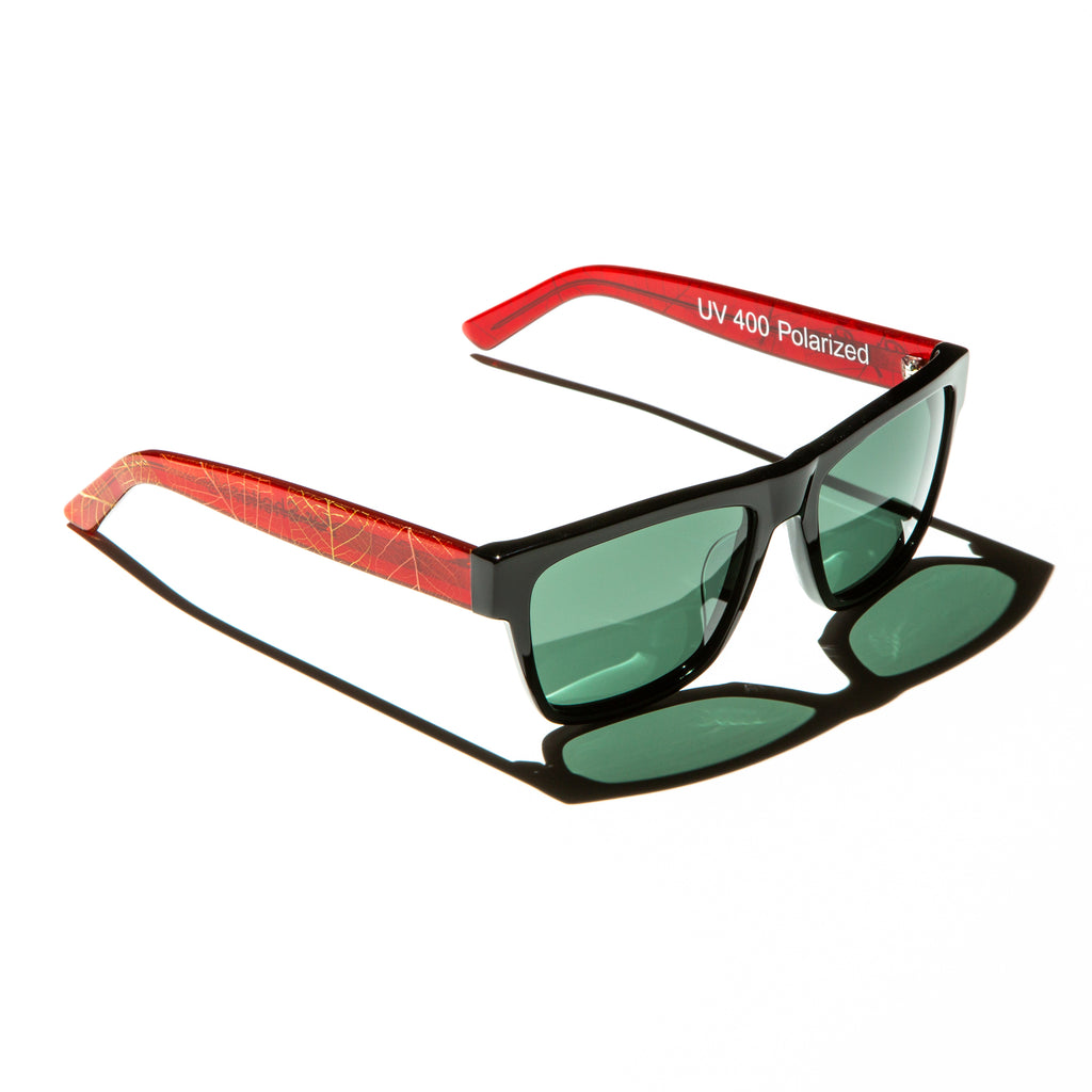 Green lens sunglasses with polished red and gold leaf temples