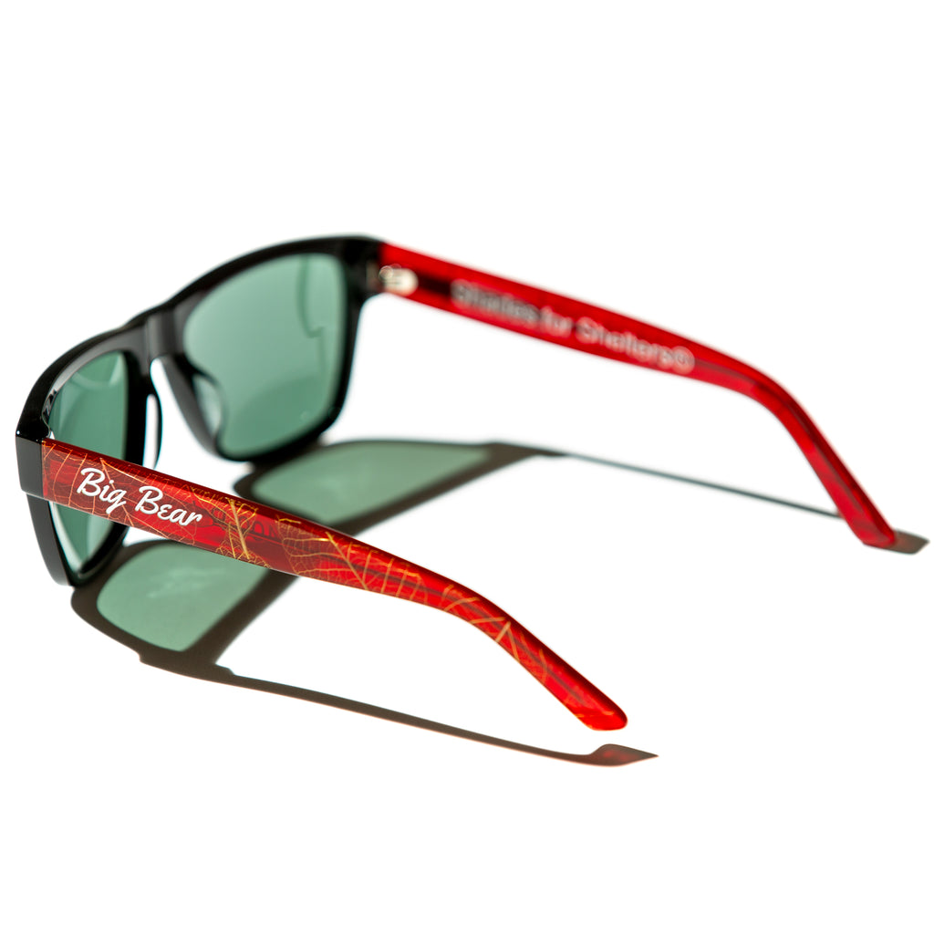 Green lens sunglasses with polished red and gold leaf temples