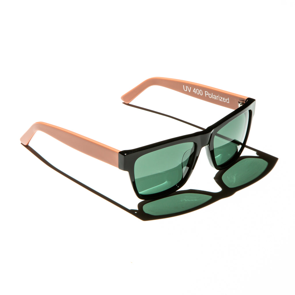 Green lens sunglasses with polished salmon pink temples