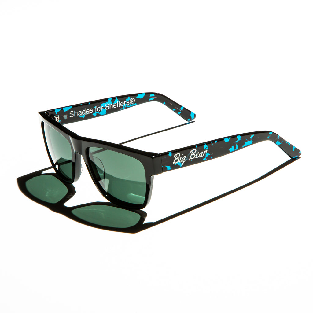 Green lens sunglasses with polished teal tortoiseshell temples