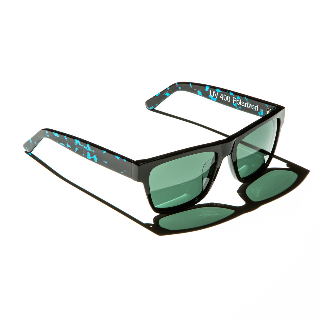 Green lens sunglasses with polished teal tortoiseshell temples