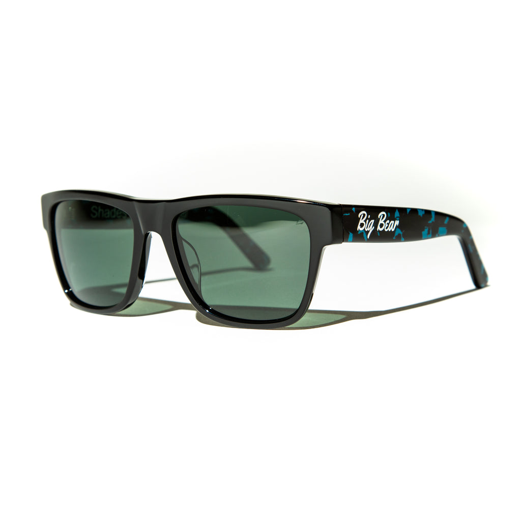 Green lens sunglasses with polished teal tortoiseshell temples