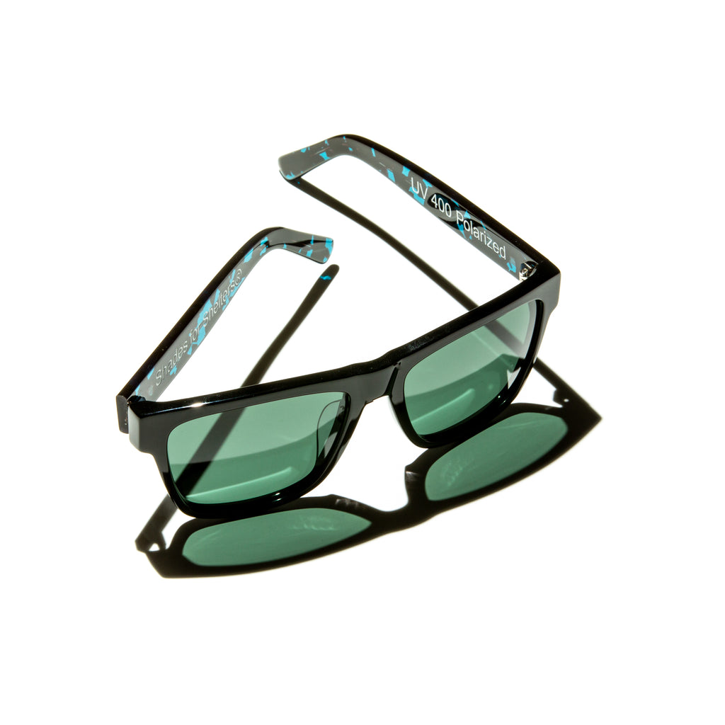 Green lens sunglasses with polished teal tortoiseshell temples