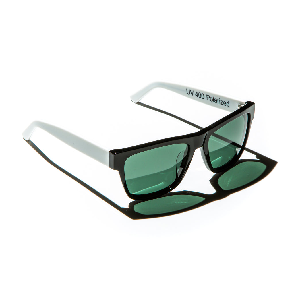 Green lens sunglasses with polished white temples