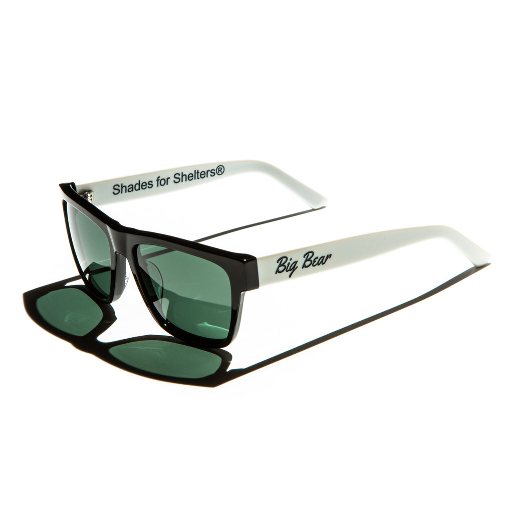 Green lens sunglasses with polished white temples